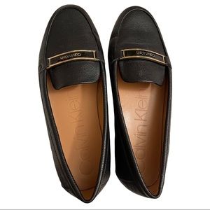Calvin Klein, LIRA black loafers, with gold branding in front. Classy, size 8.5